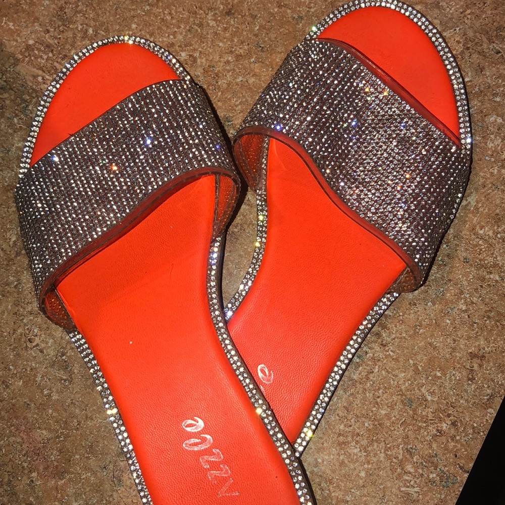 Orange Sandle slippers.